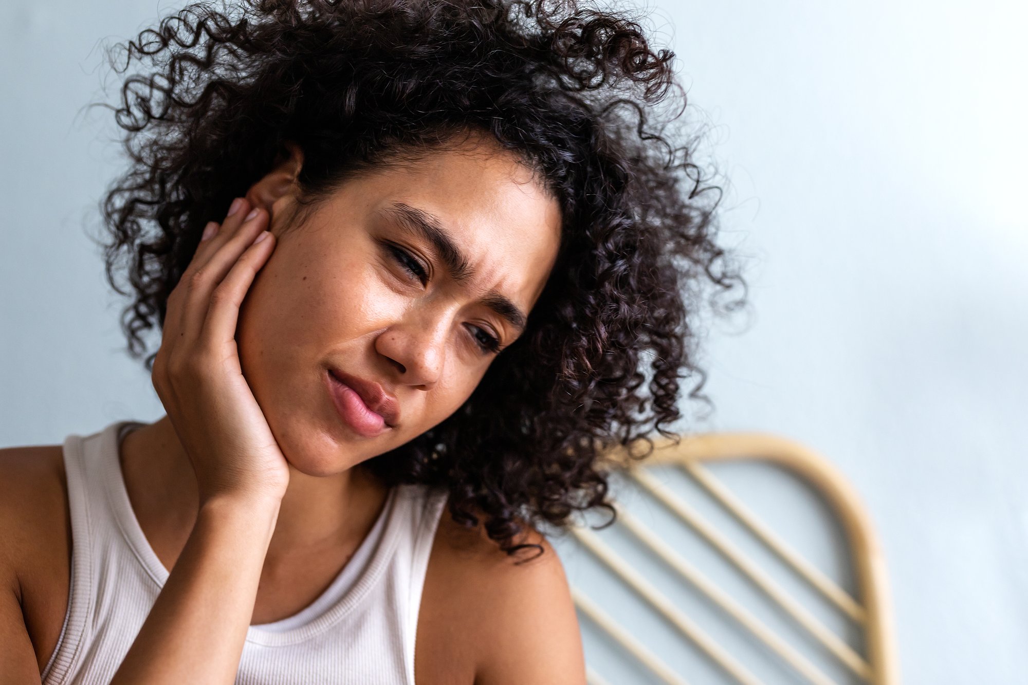 young-woman-touching-ear-in-pain
